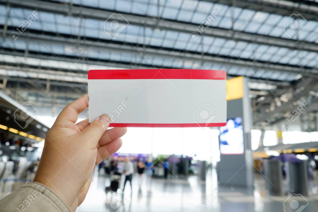 Download Hands Holding A Mockup Air Ticket In Airport Terminal Stock Photo Picture And Royalty Free Image Image 99976408