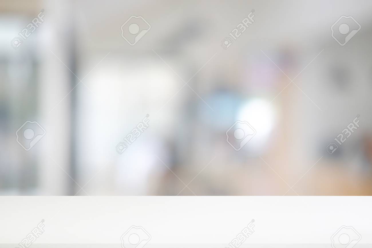 white table is empty with blurred office background stock photo blurred office background