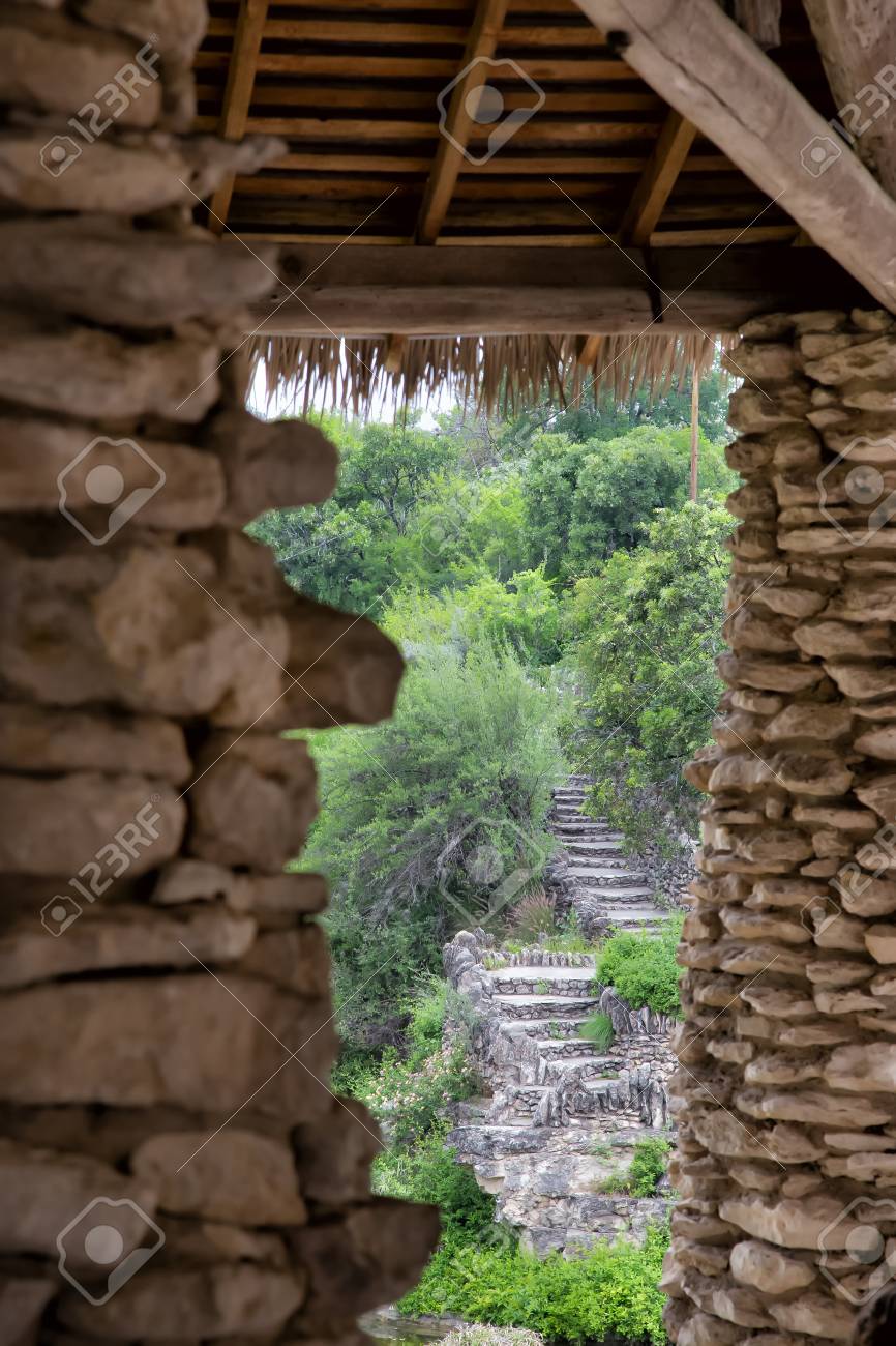 Asian Rock Pillars And Grass Roof Overlooking Green Rock Garden Stock Photo Picture And Royalty Free Image Image 90956976