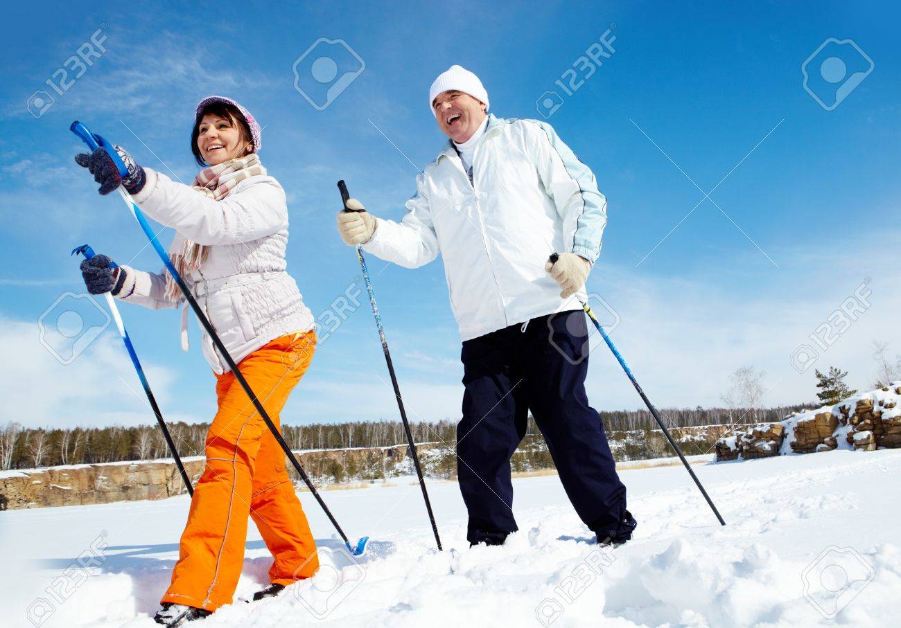 Portrait of mature couple skiing outside - 15436473 Portrait of mature couple skiing outside - 15436473