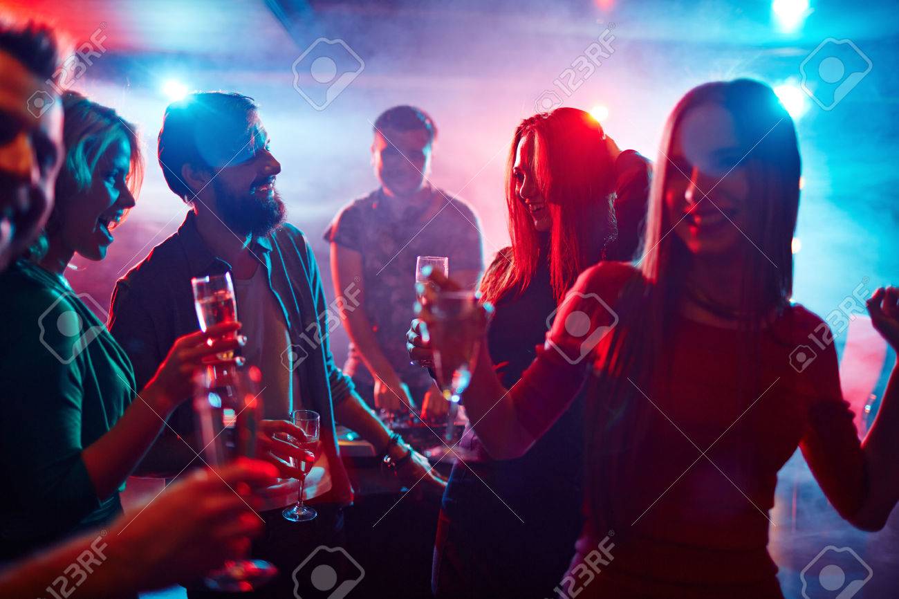 Happy Friends Toasting At Night Party Stock Photo, Picture And Royalty Free Image. Image 38887738.
