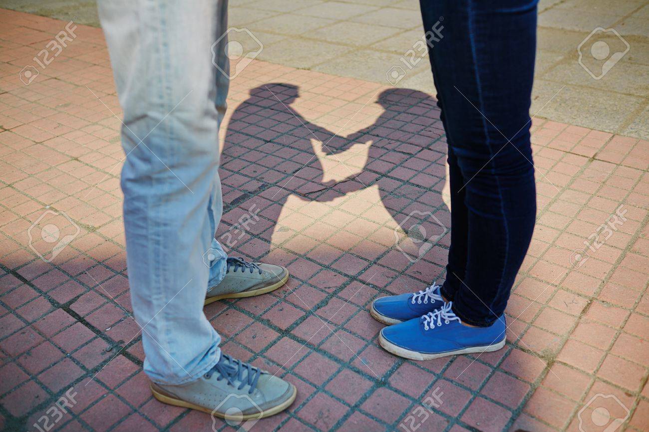 Young Couple In Jeans And Sports Shoes Standing On Trottoire Stock