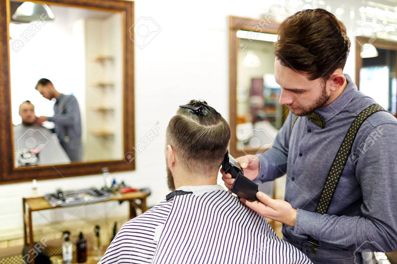 cutting hair with electric razor