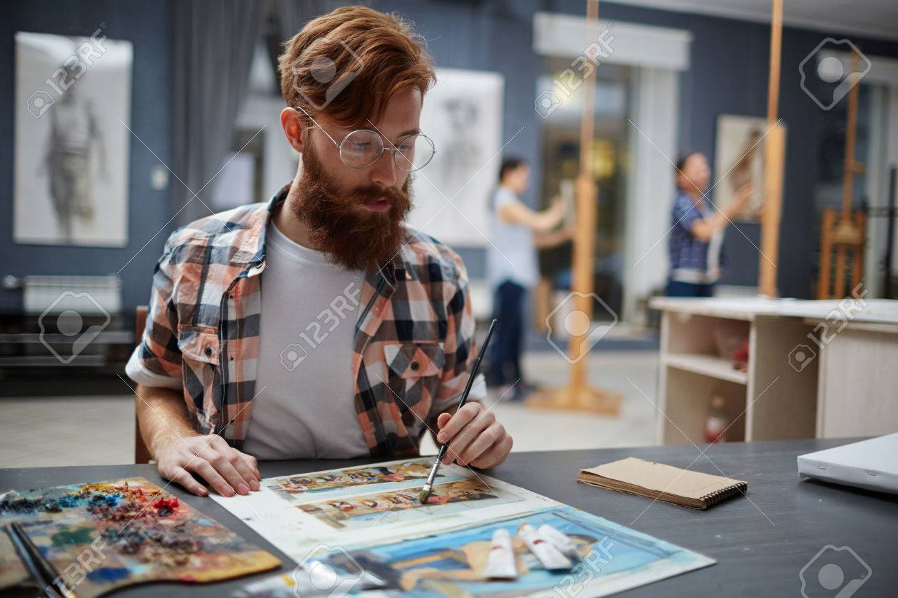 hipster artist painting pictures in art class stock photo picture