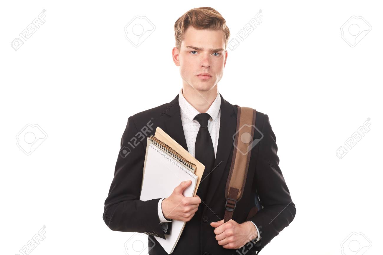 studio portrait of teenage college student in black suit posing teenage college