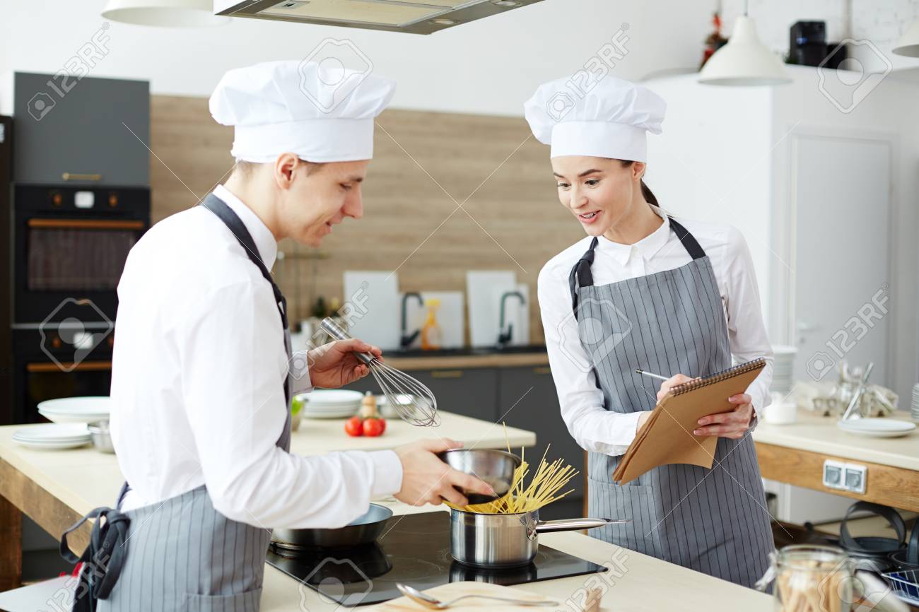 Surprised Cooking Expert Controlling Young Cook Stock Photo Picture And Royalty Free Image Image 105504100