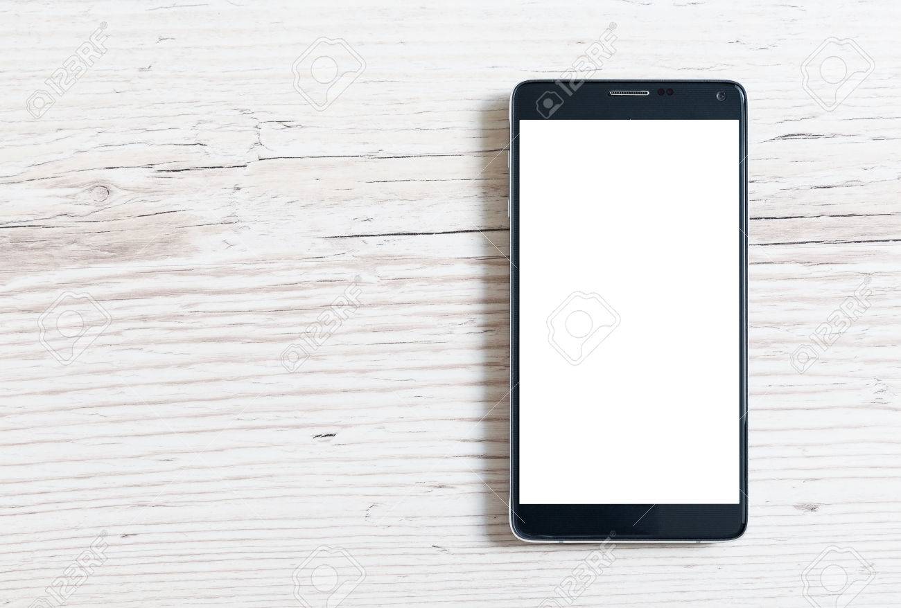 Black smart phone with isolated screen on wooden table - 45009601 Black smart phone with isolated screen on wooden table - 45009601