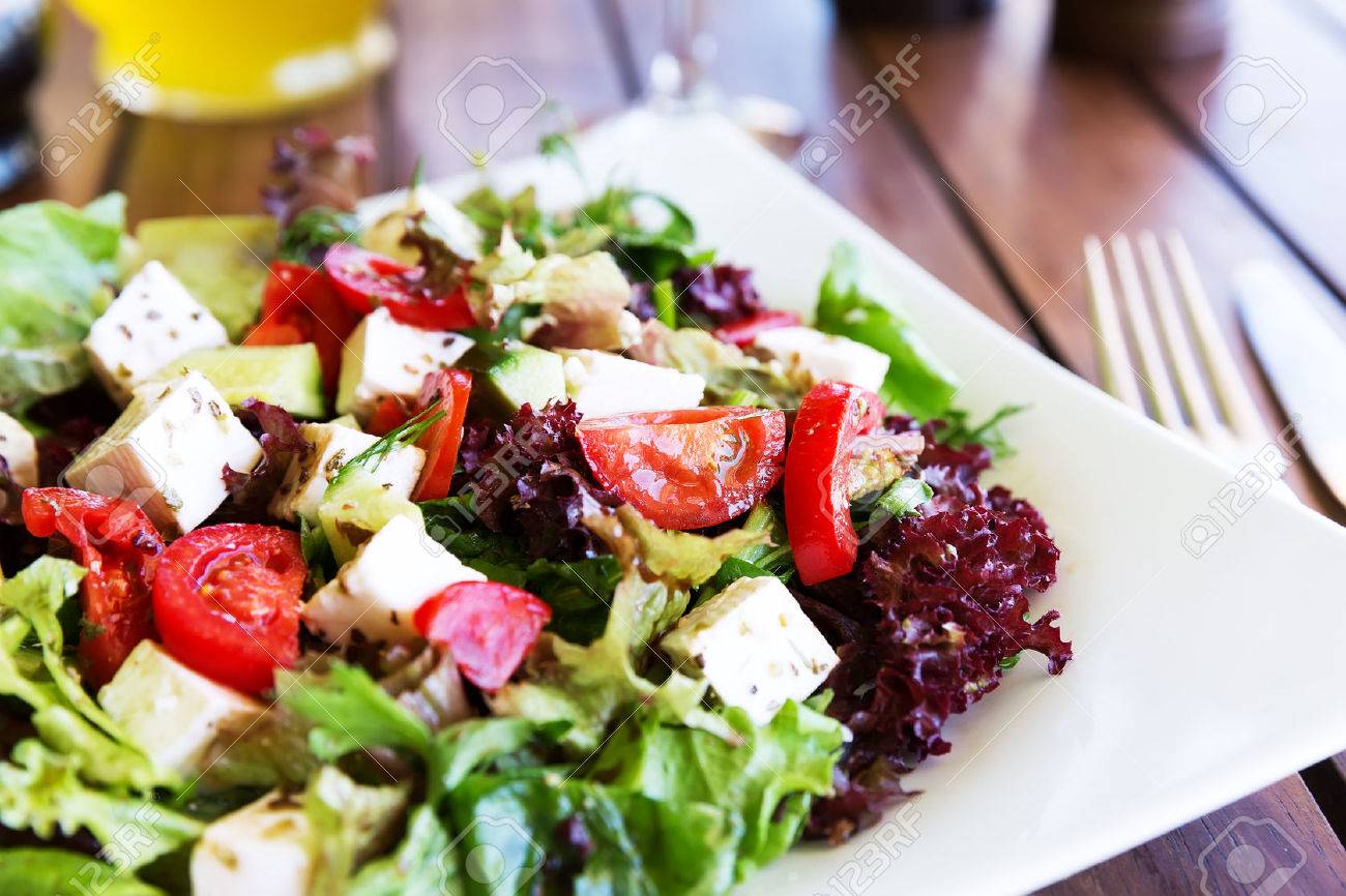Greek Mediterranean salad with feta cheese, tomatoes and peppers. Mediterranean salad. Mediterranean cuisine. Greek cuisine. - 47187531 Greek Mediterranean salad with feta cheese, tomatoes and peppers. Mediterranean salad. Mediterranean cuisine. Greek cuisine. - 47187531