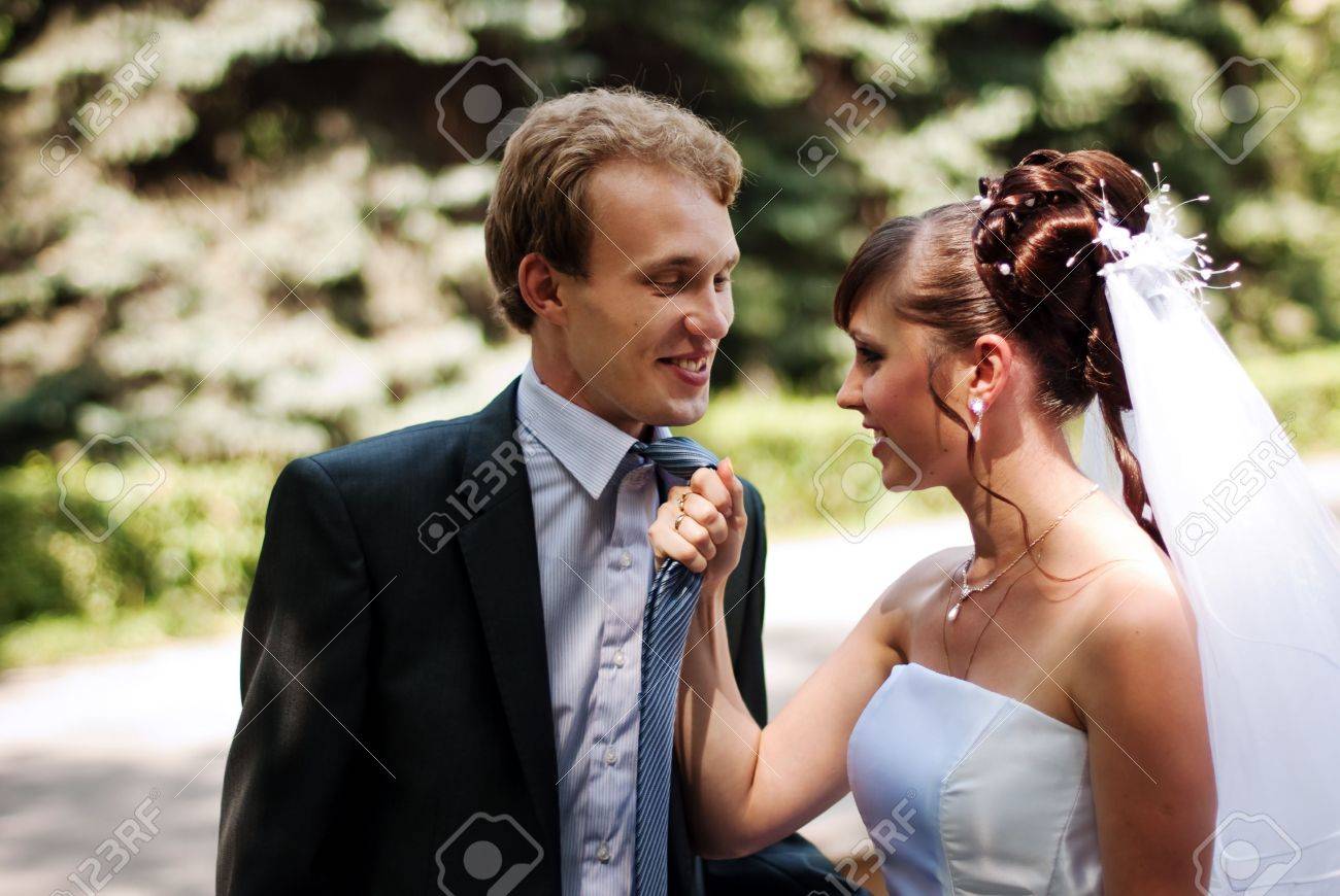 Her Husband For A Tie Stock Photo