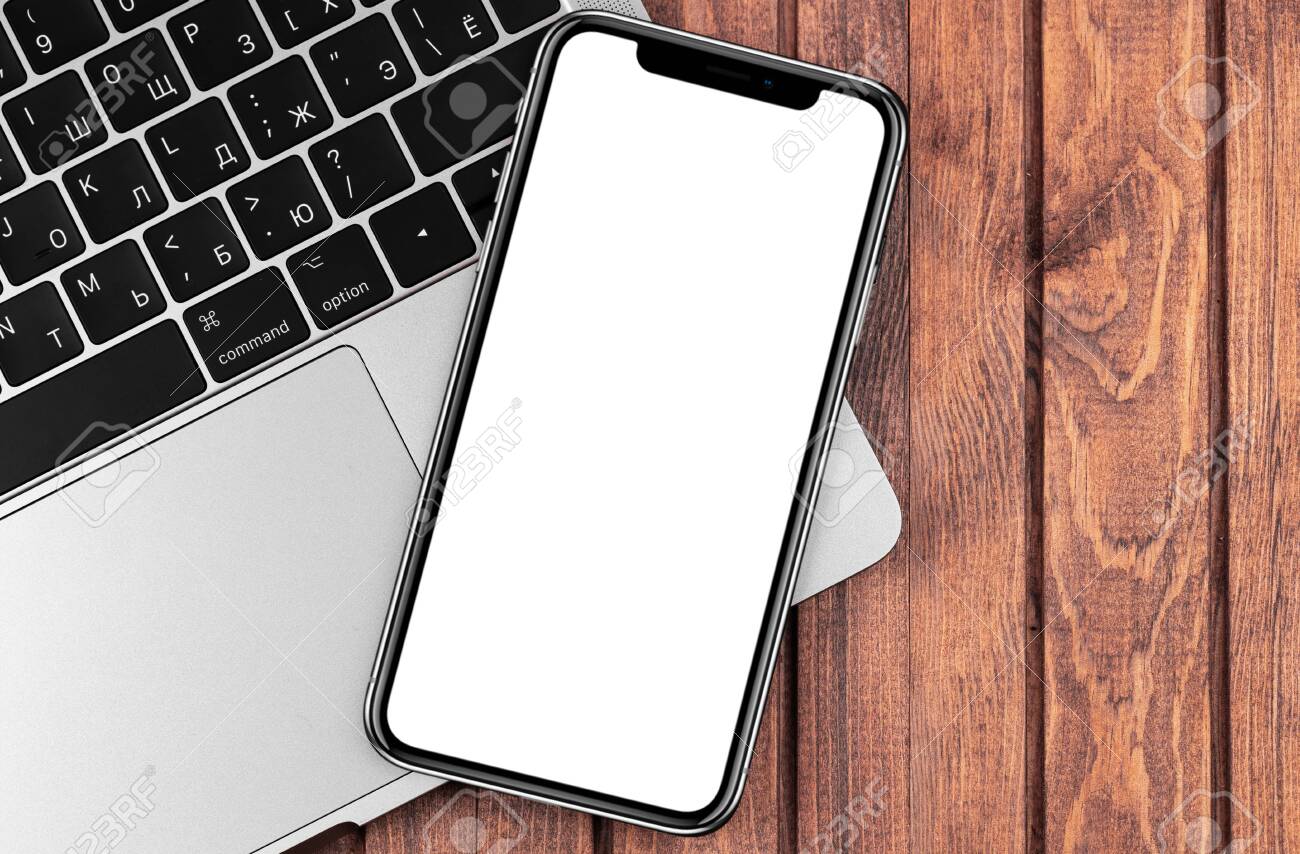 Iphone Mockup With Macbook Closeup On Wooden Desk Blank Screen Mobile Phone For Graphic Display Montage Moscow Russia December 26 19 Stock Photo Picture And Royalty Free Image Image