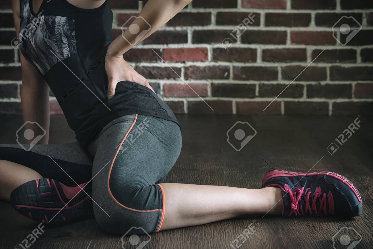 pushing her body too far got low back pain in fitness exercise