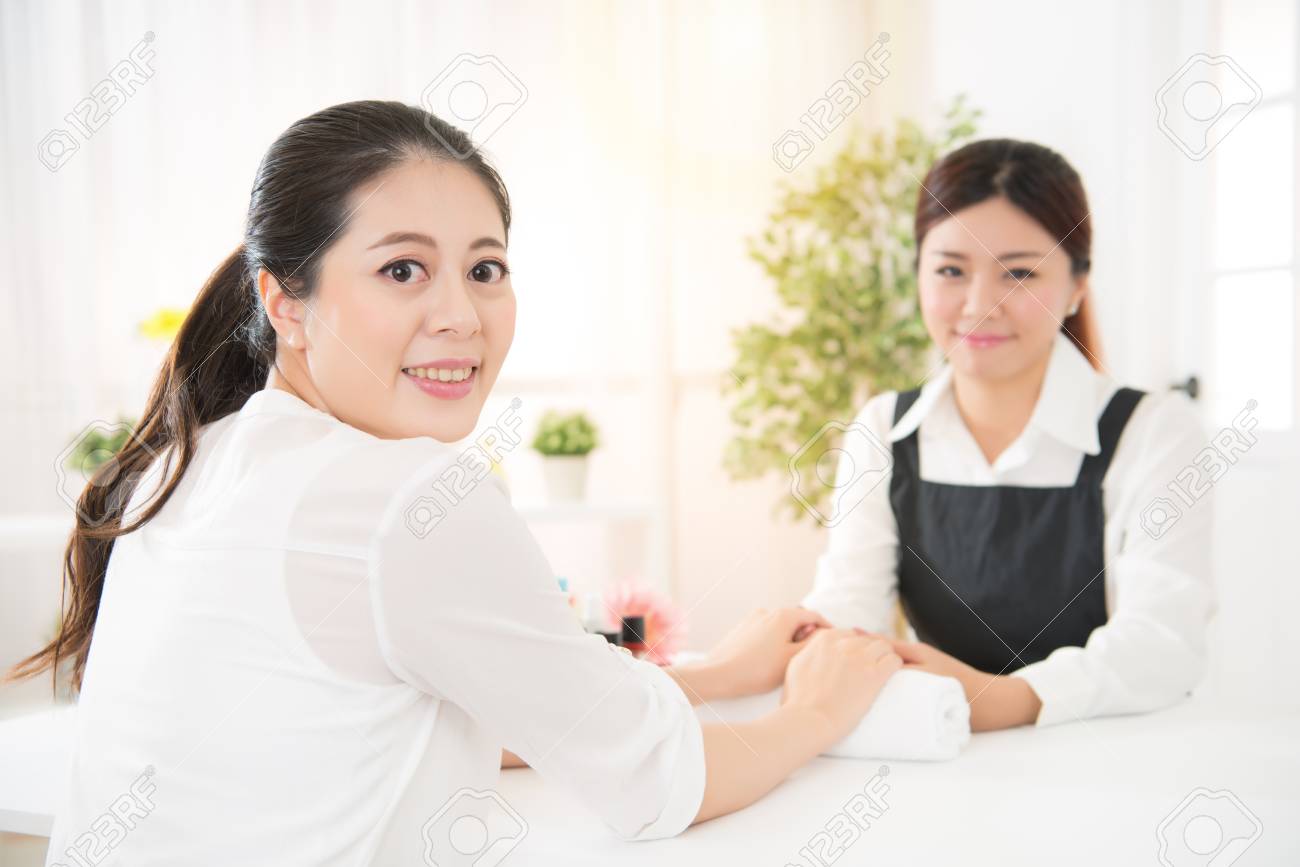 Happy Female Asian Nail Salon Customer 