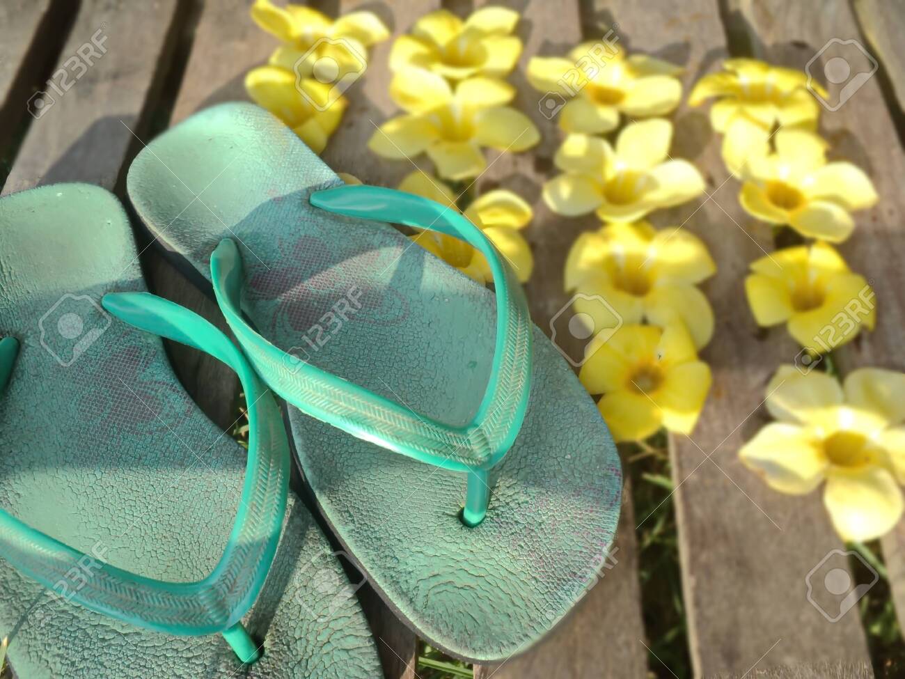 yellow flower flip flops