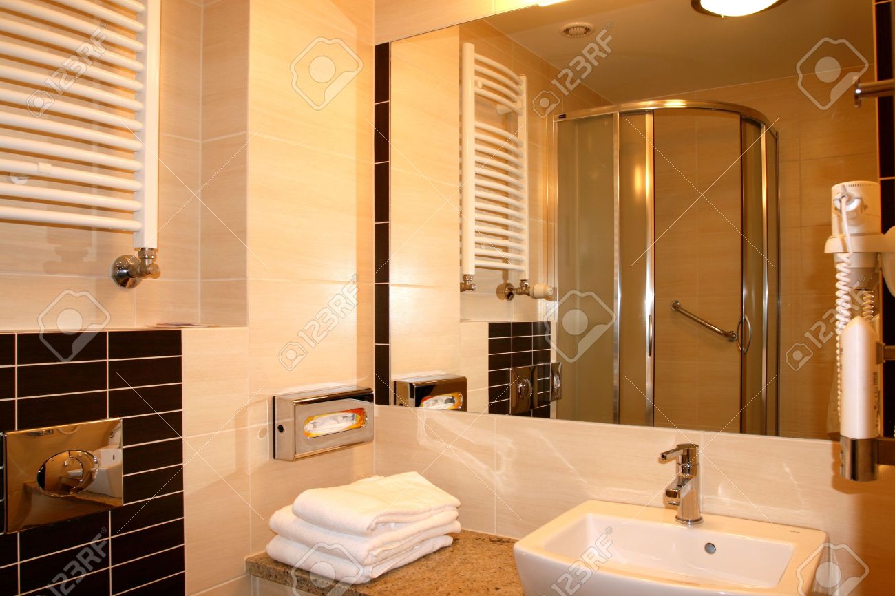 modern exclusive hotel bathroom interior. mirror reflection. stock modern exclusive hotel bathroom interior. mirror reflection. stock