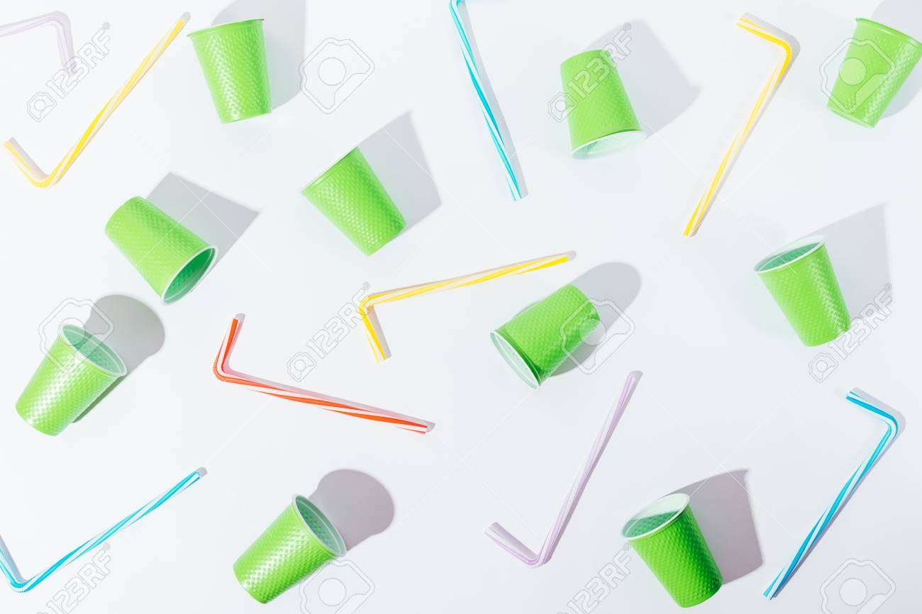 flat lay pattern decoration of disposable cups and straws overhead