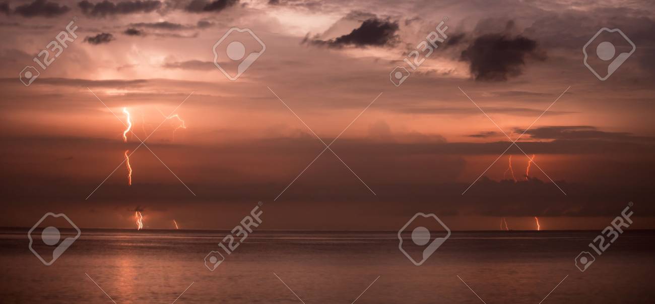 bolts of lightning in the night sky long exposure stock photo