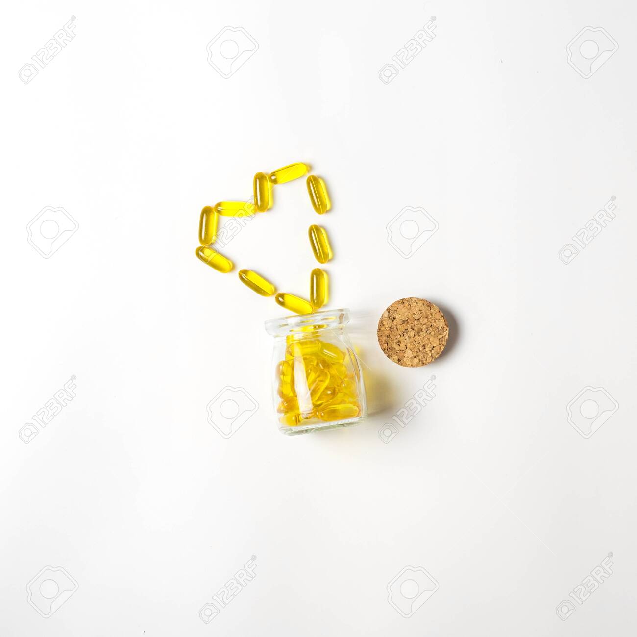 Download Glass Vial With Yellow Vitamins Tablets Fish Oil Omega Vitamin Stock Photo Picture And Royalty Free Image Image 141052164 Yellowimages Mockups