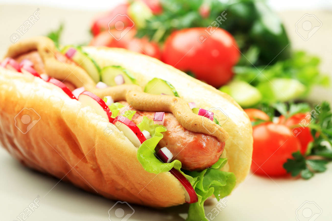 Close up of hot dog. Fast food. Isolated over white background. - 7702564 Close up of hot dog. Fast food. Isolated over white background. - 7702564