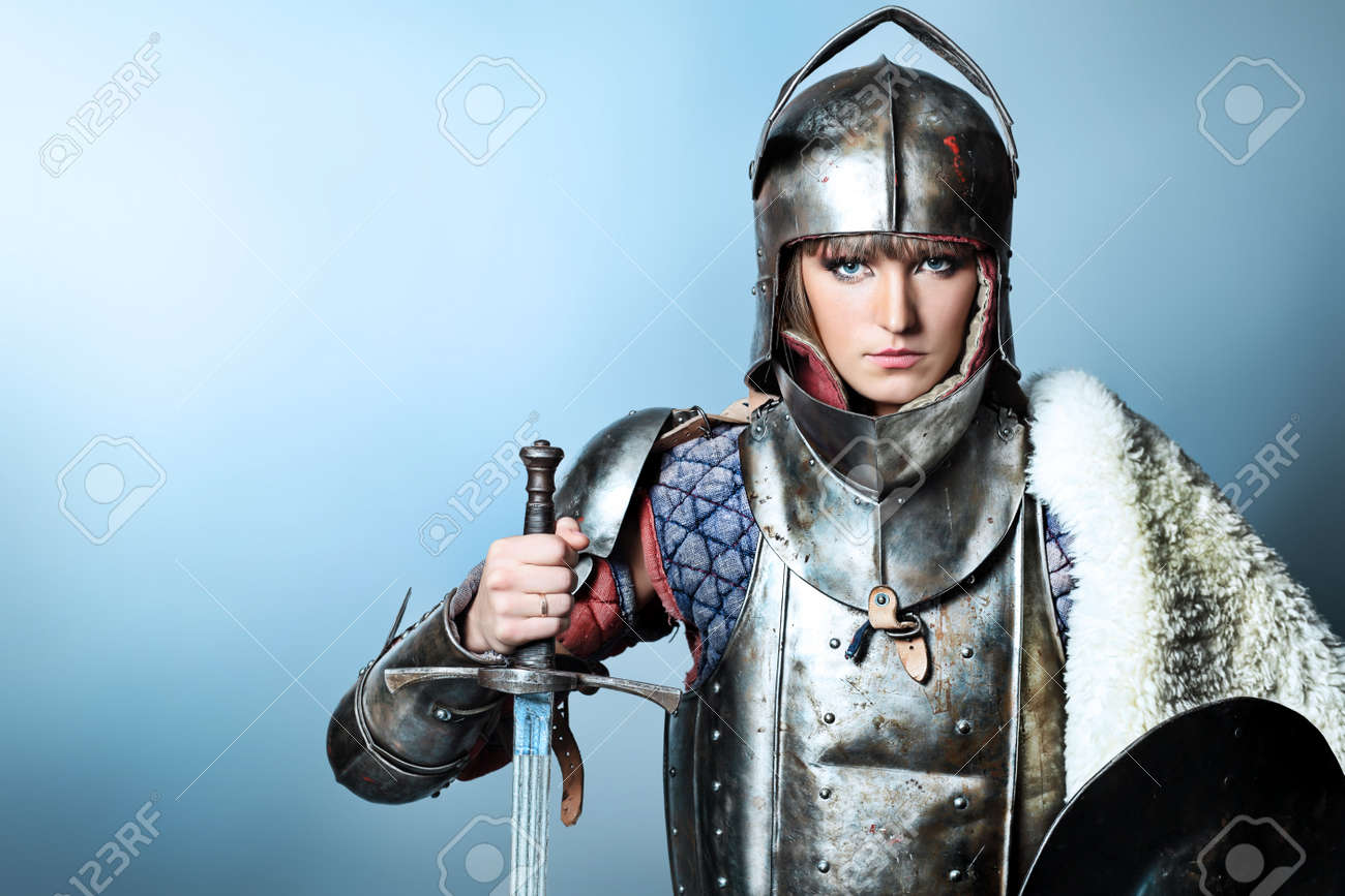 Portrait of a medieval female knight in armour over grey background. - 8217522 Portrait of a medieval female knight in armour over grey background. - 8217522