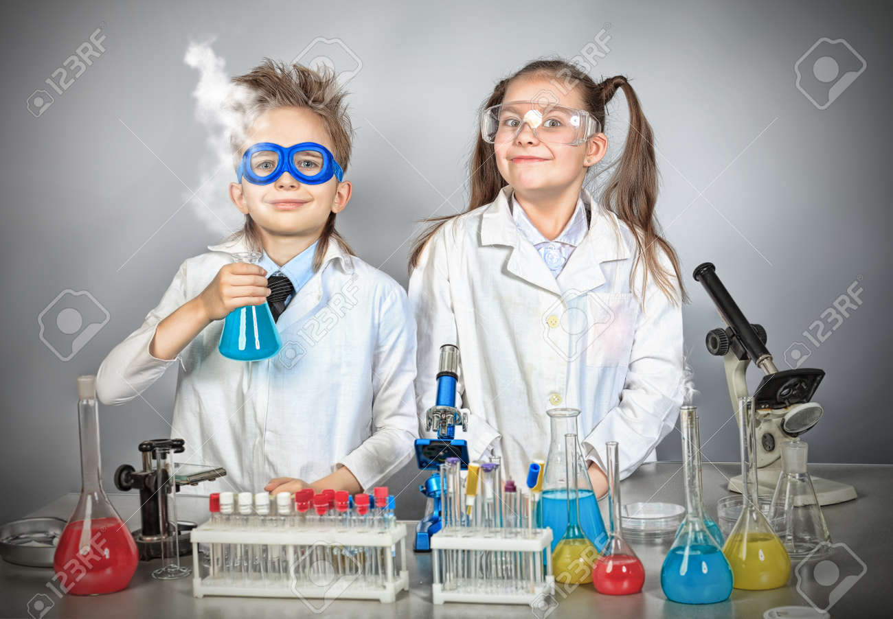 Two children making science experiments. Education. - 12521777 Two children making science experiments. Education. - 12521777