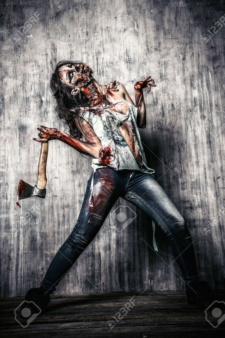 35163849-Scary-bloody-zombie-girl-with-an-ax-Halloween--Stock-Photo.jpg