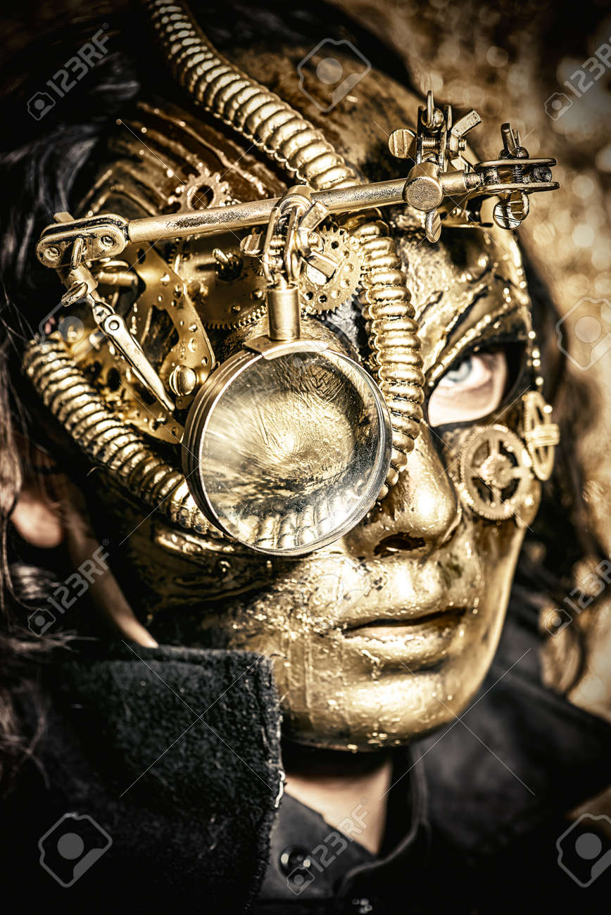 steampunk man wearing mask with various mechanical devices stock