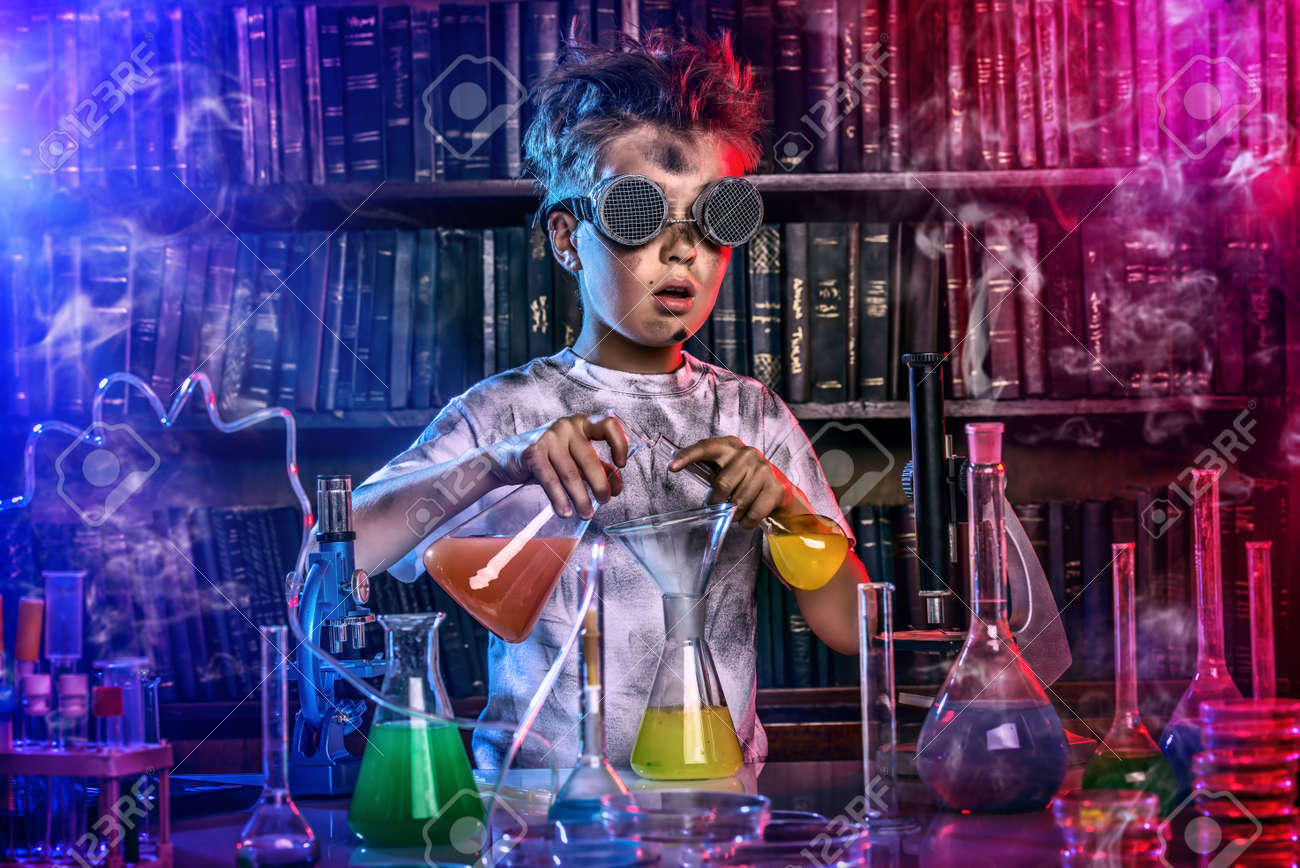 A boy doing experiments in the laboratory. Explosion in the laboratory. Science and education. - 51504143 A boy doing experiments in the laboratory. Explosion in the laboratory. Science and education. - 51504143