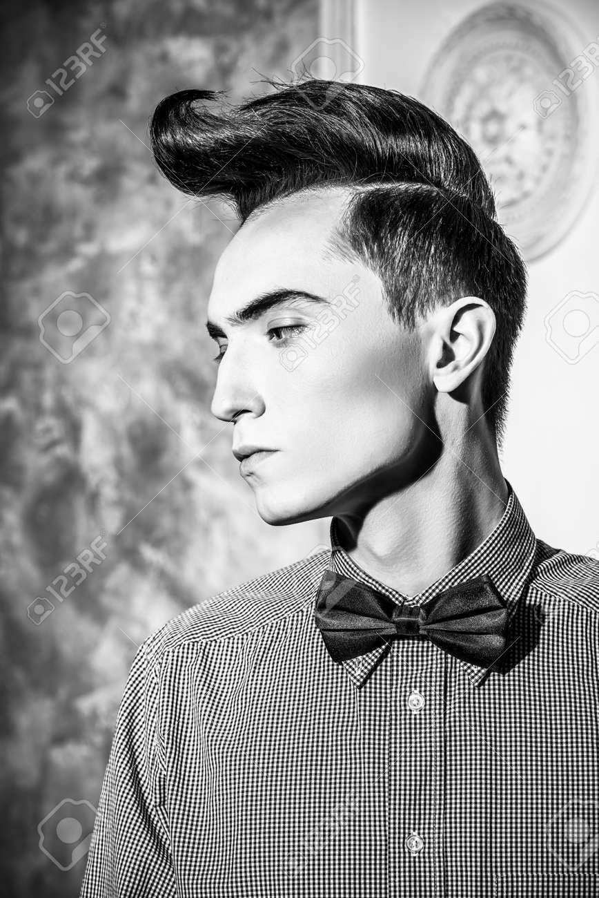 Fashion Studio Shot Of A Handsome Male Model With Stylish Hair