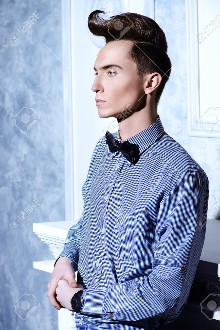 Fashion Studio Shot Of A Handsome Male Model With Stylish Hair