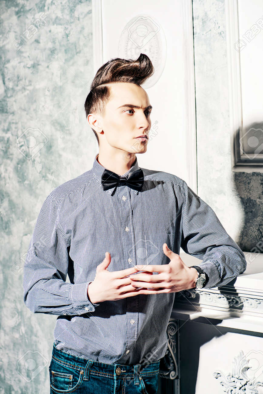 Fashion Studio Shot Of A Handsome Male Model With Stylish Hair