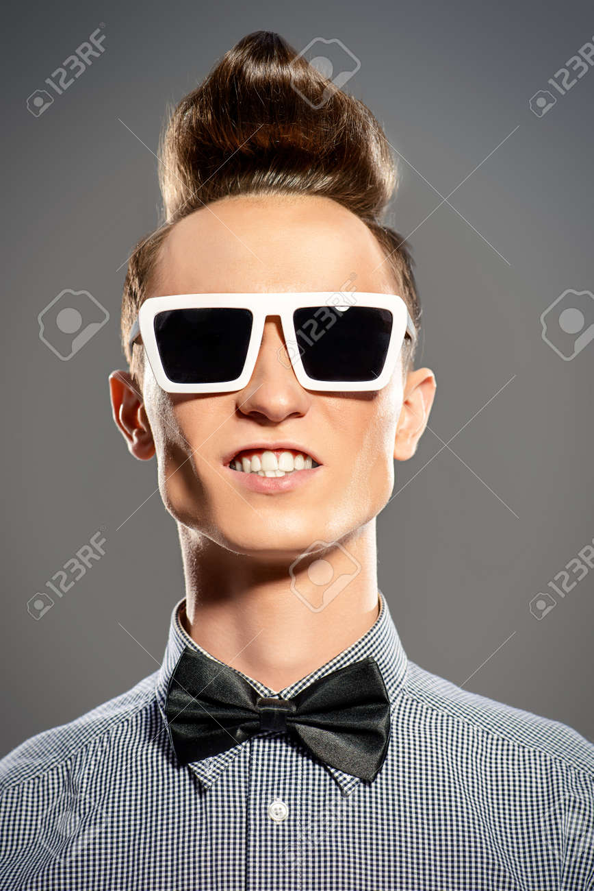 Fashion Studio Shot Of A Handsome Male Model With Stylish Hair