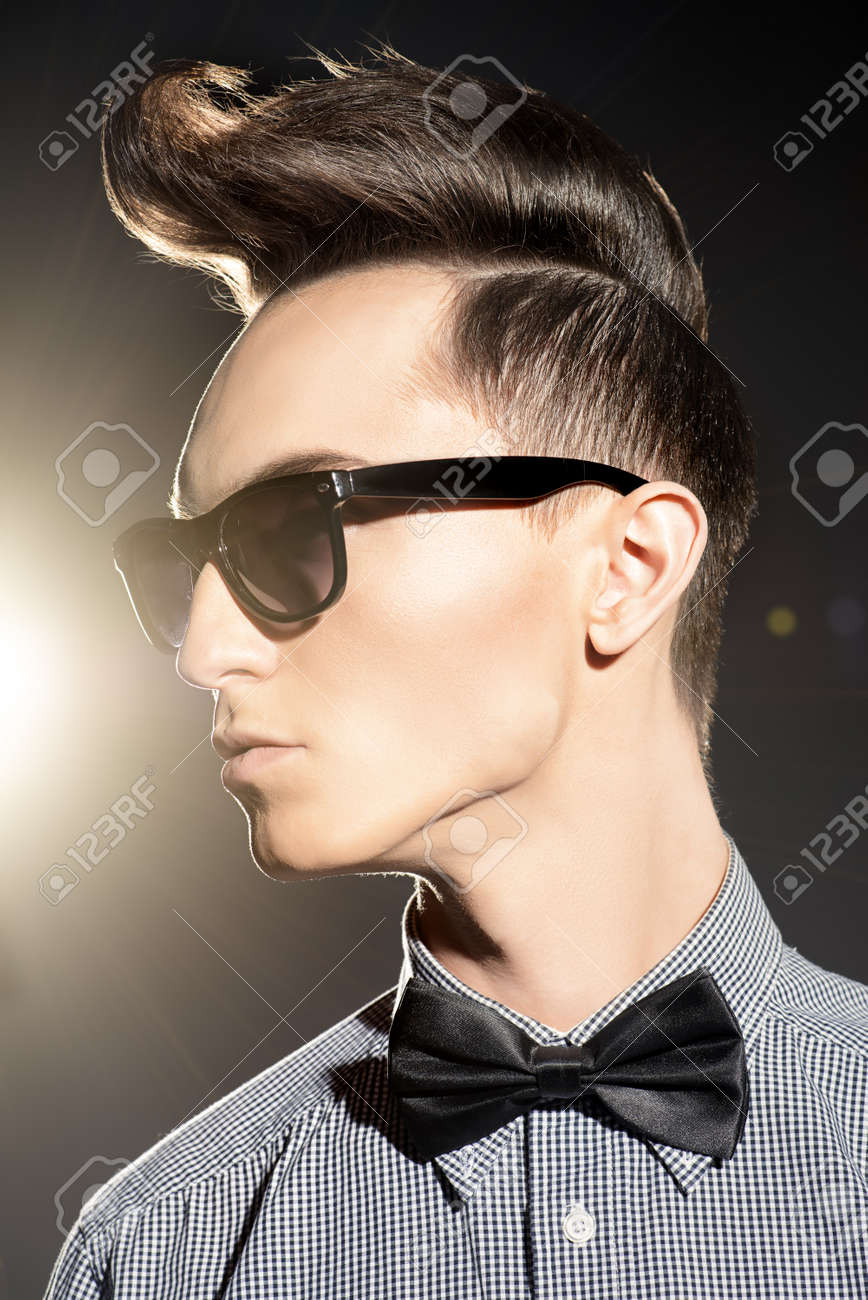 Fashion Studio Shot Of A Handsome Male Model With Stylish Hair