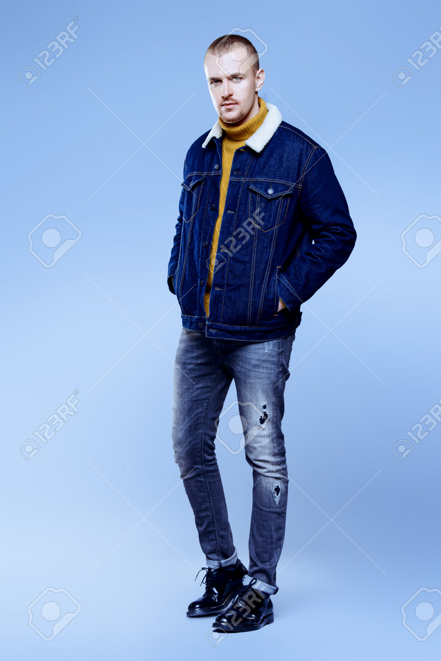 Fashion Shot Of A Male Model Posing In Jeans Clothes At Studio