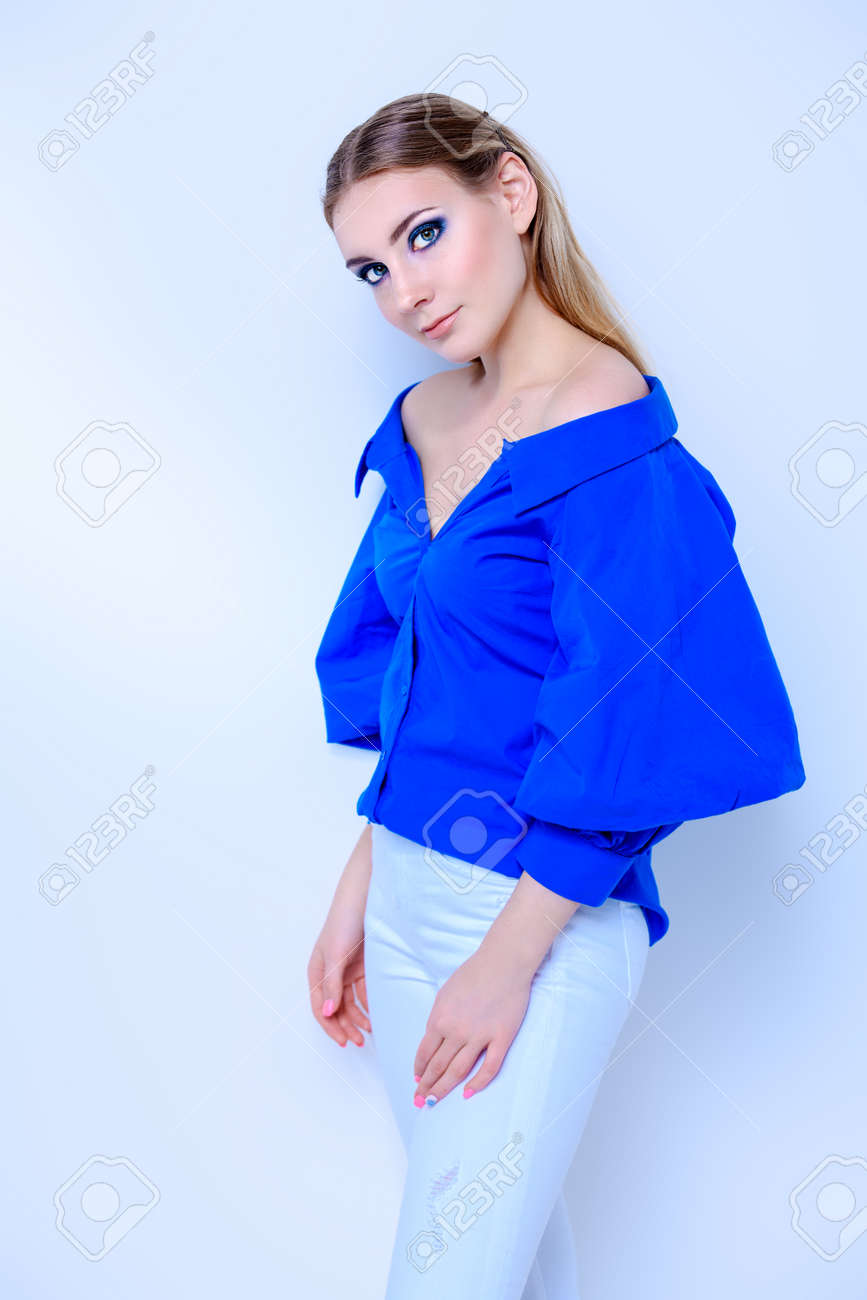 blue blouse and white pants