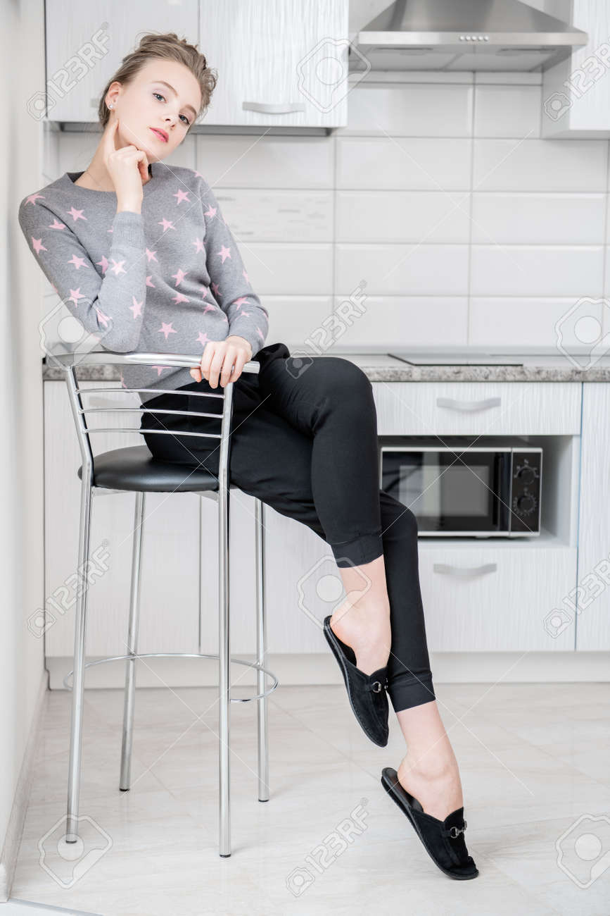 Fashion Shot Beautiful Female Model Is Sitting On A Bar Stool