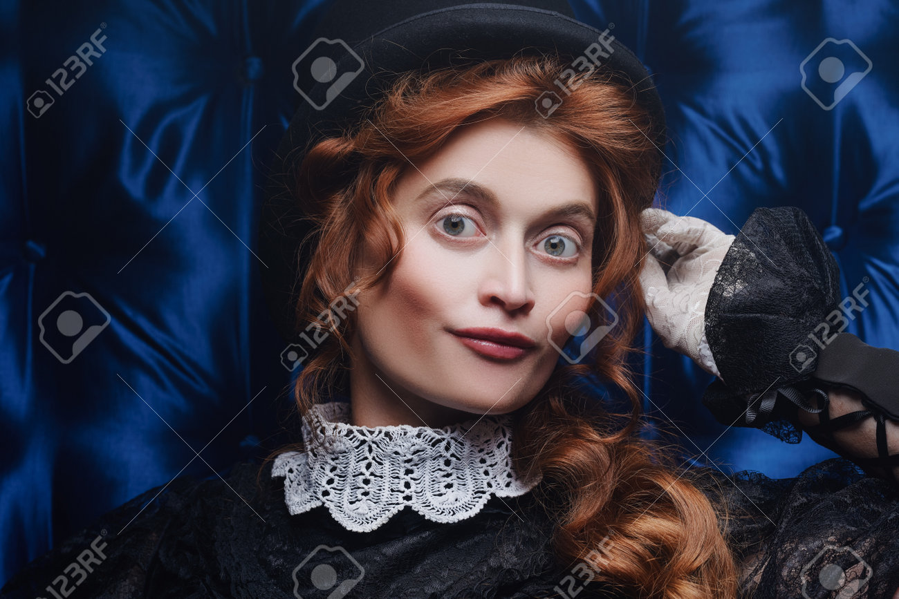 Close,up portrait of an elegant Victorian woman in black dress..