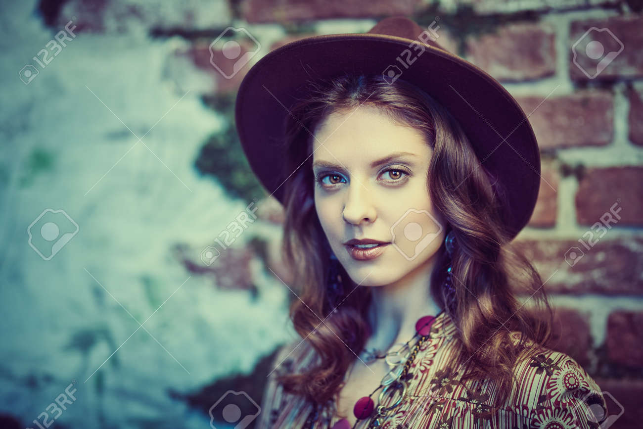 Portrait of a gorgeous young woman in boho style dress and accessories posing against the backdrop of the ruined walls, overgrown with moss. Bohemian, modern hippie style. - 145388934 Portrait of a gorgeous young woman in boho style dress and accessories posing against the backdrop of the ruined walls, overgrown with moss. Bohemian, modern hippie style. - 145388934