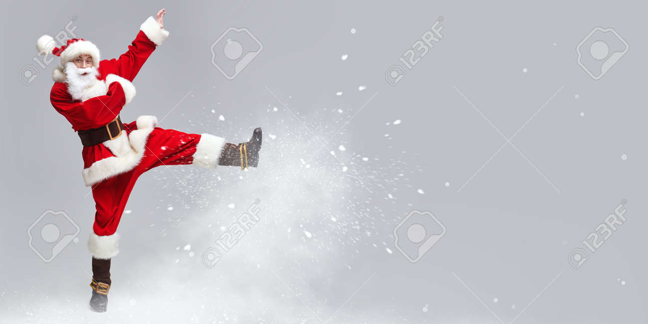 A Jolly Young Man Dressed As Santa Claus Jumps And Playing Pranks With Snow Merry Christmas And Happy New Year Copy Space Stock Photo Picture And Royalty Free Image Image 159430863