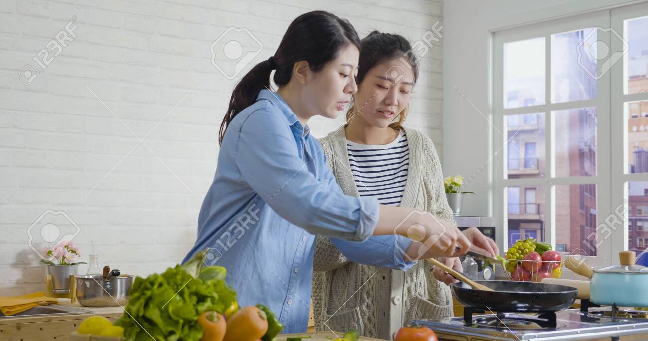 Skillful Asian Chinese Woman Cooking At
