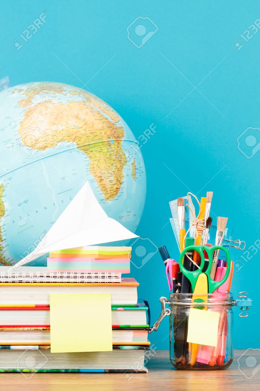 School Accessories On Desktop With Blank Blue Background