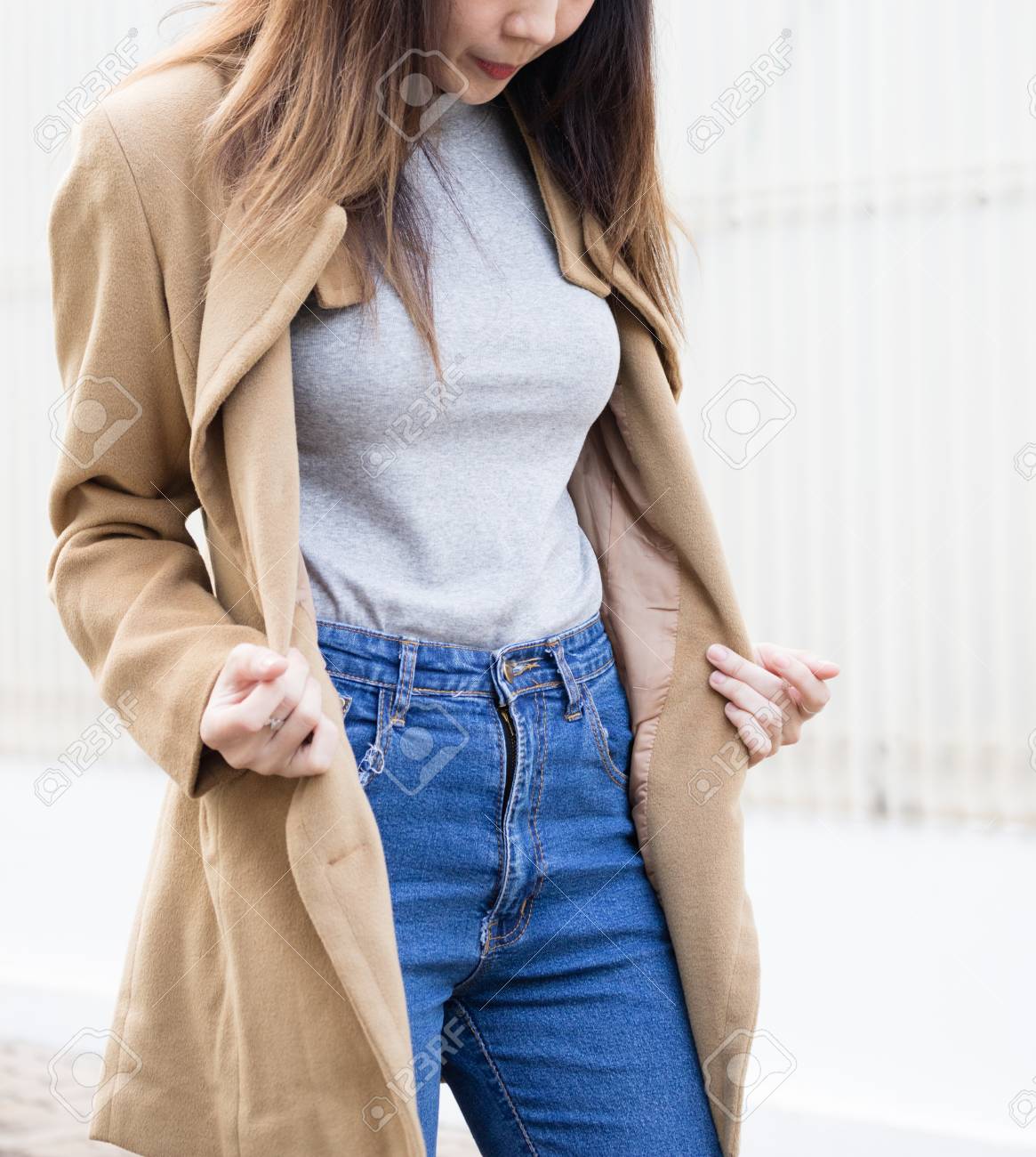 tan jacket blue jeans