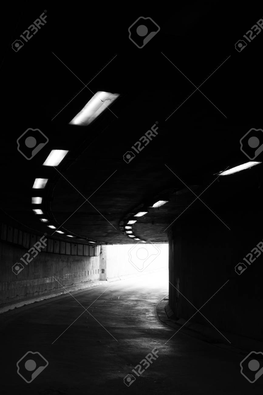 Stock photo the light at the end of the tunnel black and white photo with grain added