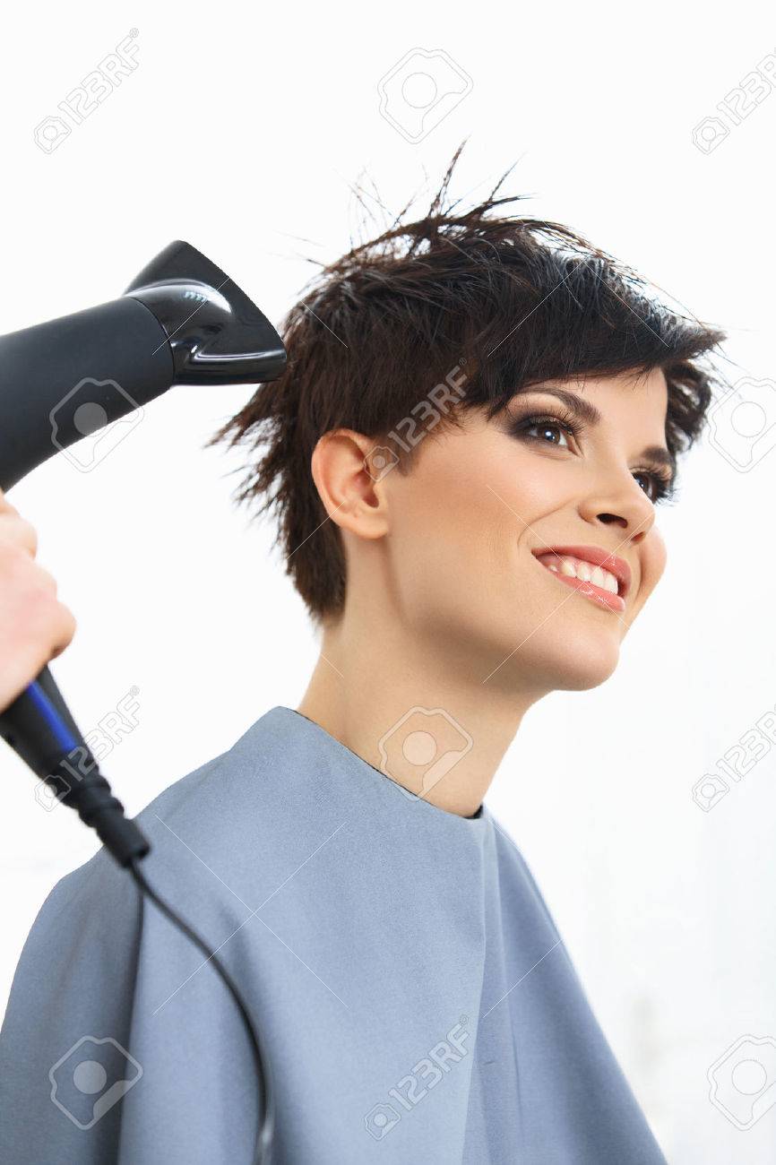 Hairdresser Using Dryer On Woman Wet Hair In Salon Short Hair