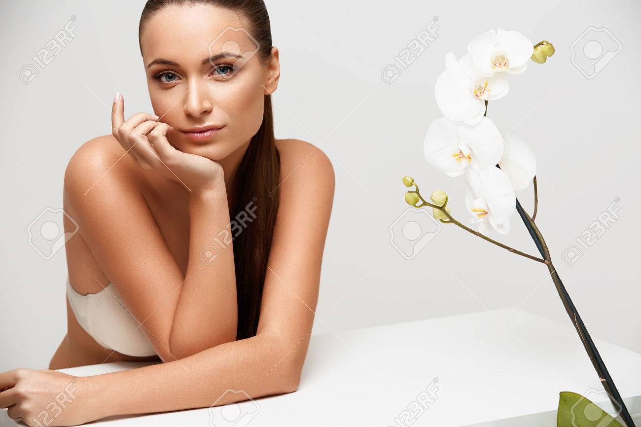 Spa Woman. Beautiful Girl Touching Her Face. Perfect Skin. Skincare. Wellness advertising - 45940717 Spa Woman. Beautiful Girl Touching Her Face. Perfect Skin. Skincare. Wellness advertising - 45940717
