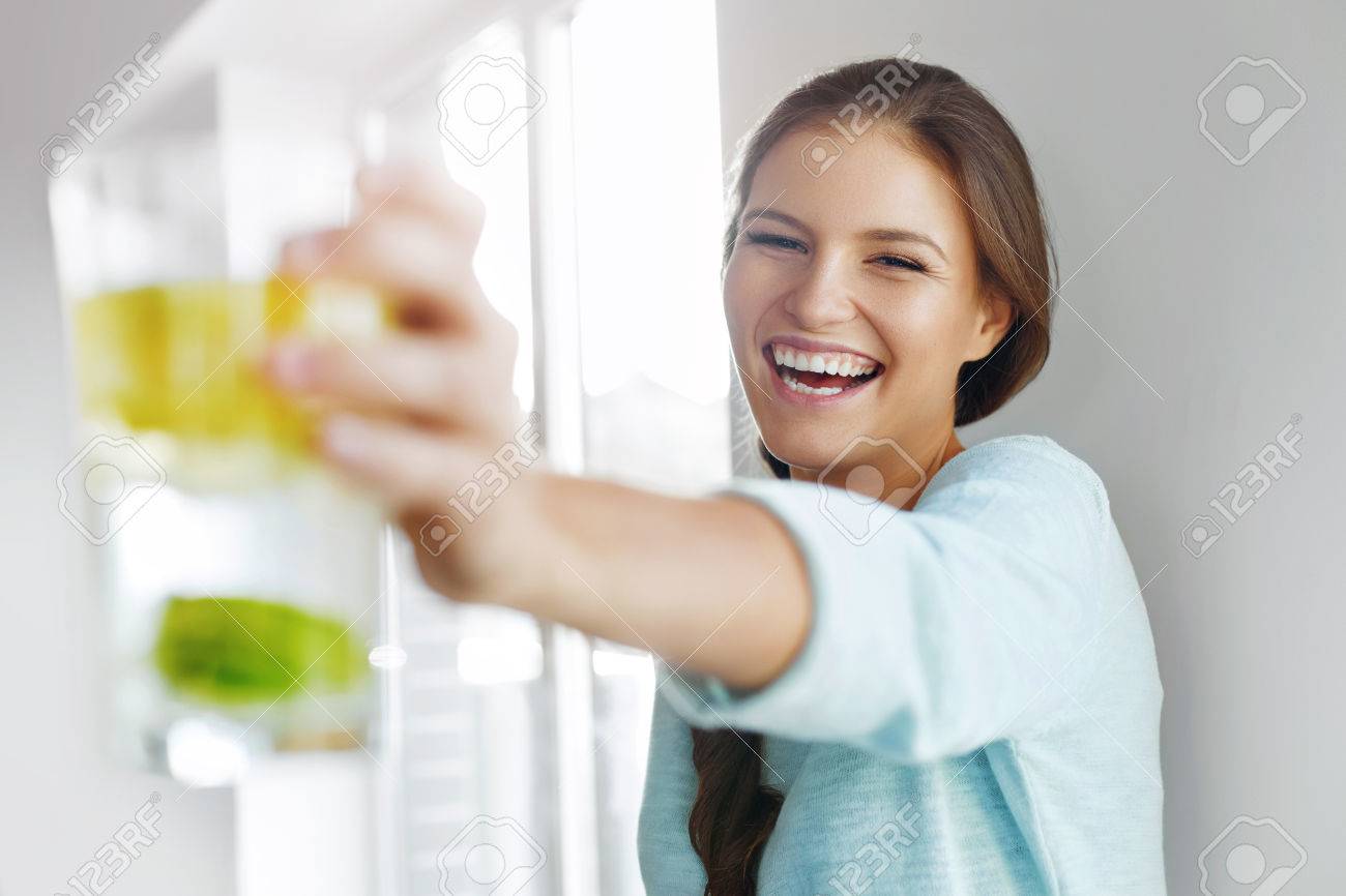Healthy Lifestyle Concept, Diet And Fitness. Smiling Woman Drinking Refreshing Water With Fresh Organic Lemon , Lime, Mint. Detox Vitamin-fortified Water. Healthy Eating, Food. Vitamin, Diet Concept. - 47894683 Healthy Lifestyle Concept, Diet And Fitness. Smiling Woman Drinking Refreshing Water With Fresh Organic Lemon , Lime, Mint. Detox Vitamin-fortified Water. Healthy Eating, Food. Vitamin, Diet Concept. - 47894683