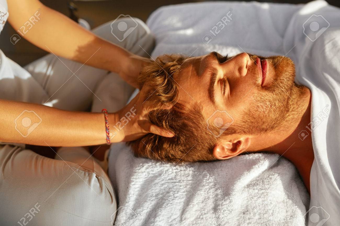Spa Massage. Closeup Of Beautiful Healthy Happy Man Enjoying Relaxing Head Massage At Outdoor Day Salon. Masseur Hands Massaging Handsome Male Head. Relax Beauty Treatment For Men, Health Care Concept - 57959149 Spa Massage. Closeup Of Beautiful Healthy Happy Man Enjoying Relaxing Head Massage At Outdoor Day Salon. Masseur Hands Massaging Handsome Male Head. Relax Beauty Treatment For Men, Health Care Concept - 57959149