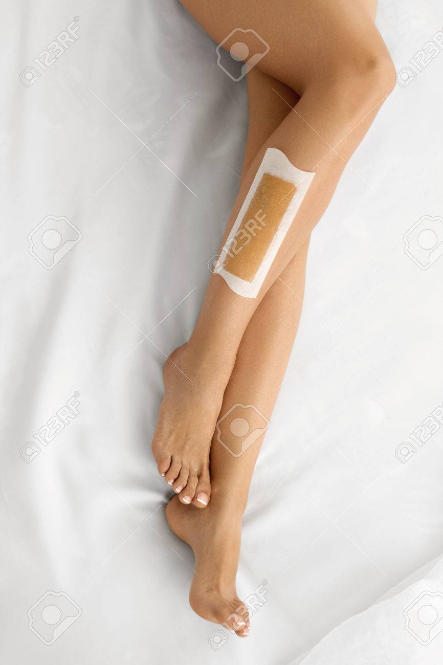 Body Care Long Woman S Legs With Wax Strip On Beautiful Female