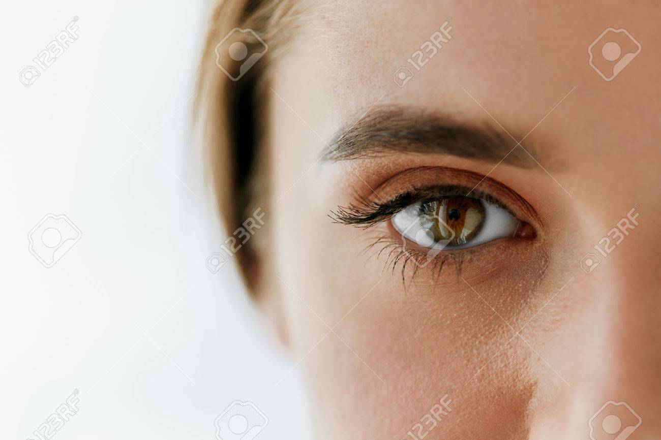 Eye Health And Care. Closeup Of Beautiful Woman Big Brown Eye And Eyebrow. Girl Eye Smooth Healthy Skin And Perfect Natural Makeup On White Background. High Resolution Image - 69164396 Eye Health And Care. Closeup Of Beautiful Woman Big Brown Eye And Eyebrow. Girl Eye Smooth Healthy Skin And Perfect Natural Makeup On White Background. High Resolution Image - 69164396