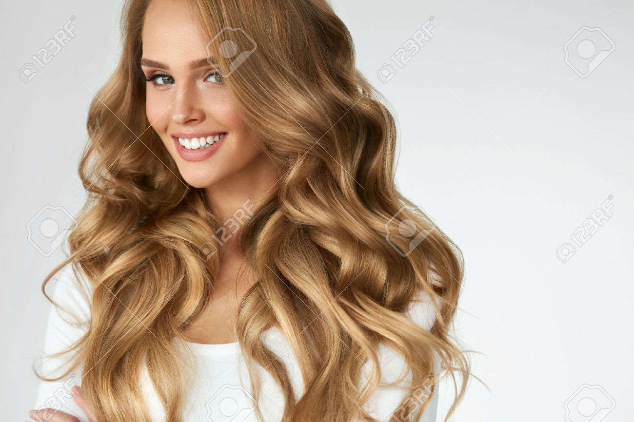Beautiful Curly Hair Smiling Girl With Healthy Wavy Long Blonde Stock Photo Picture And Royalty Free Image Image 70476687