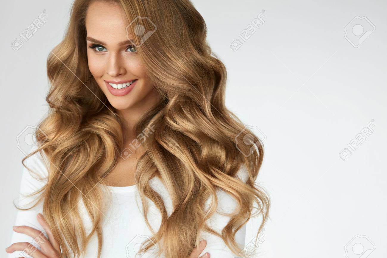 Beautiful Curly Hair. Smiling Girl With Healthy Wavy Long Blonde Hair. Portrait Happy Woman With Beauty Face, Sexy Makeup And Perfect Hair Curls. Volume, Hairstyle, Hairdressing Concept. High Quality - 70476549 Beautiful Curly Hair. Smiling Girl With Healthy Wavy Long Blonde Hair. Portrait Happy Woman With Beauty Face, Sexy Makeup And Perfect Hair Curls. Volume, Hairstyle, Hairdressing Concept. High Quality - 70476549